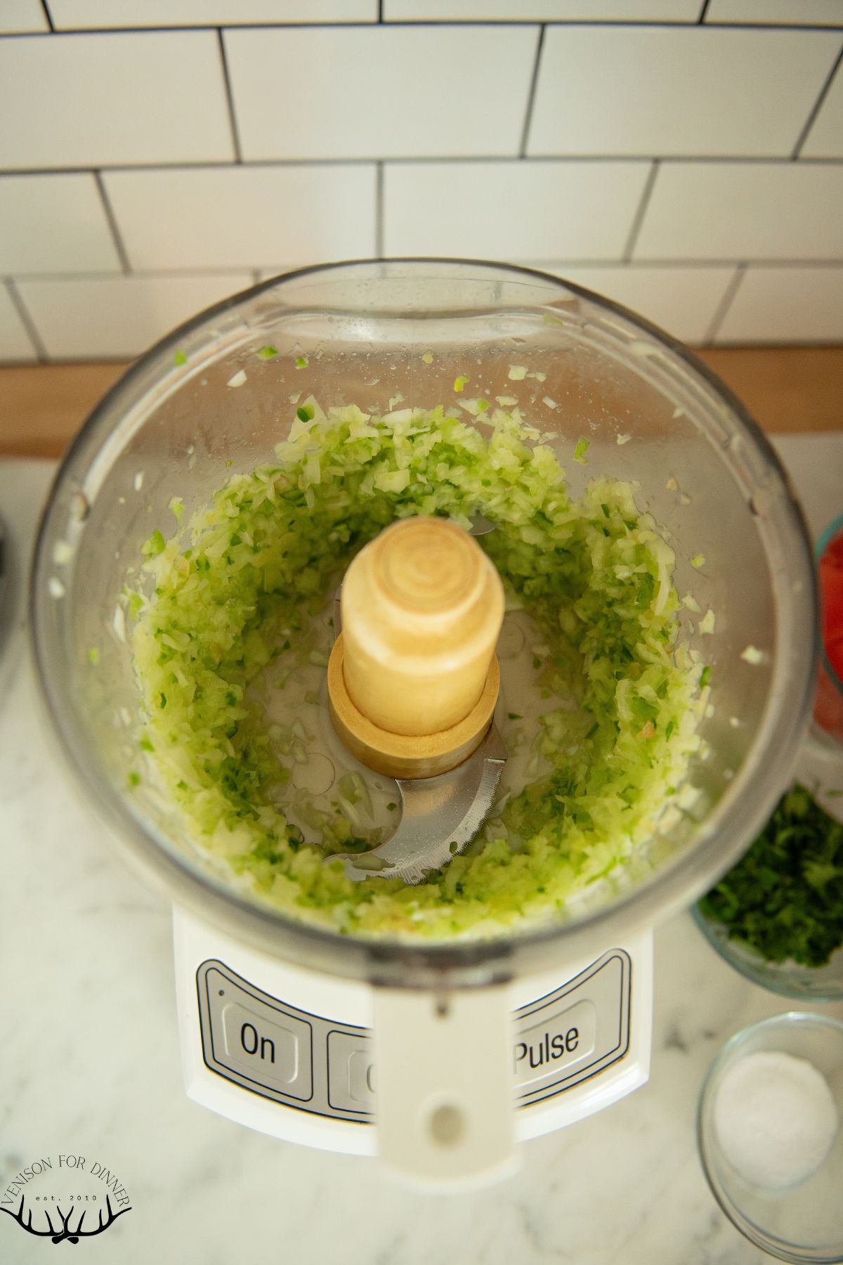 Diced peppers and onions in a food processor.