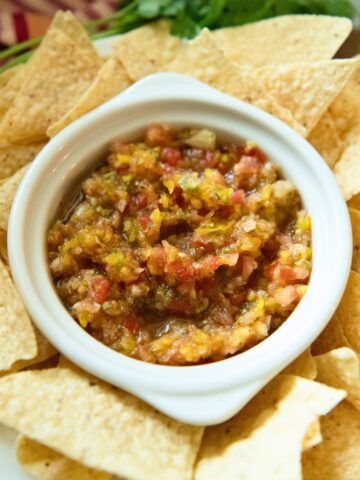 Chunky tomato salsa with tortilla chips.