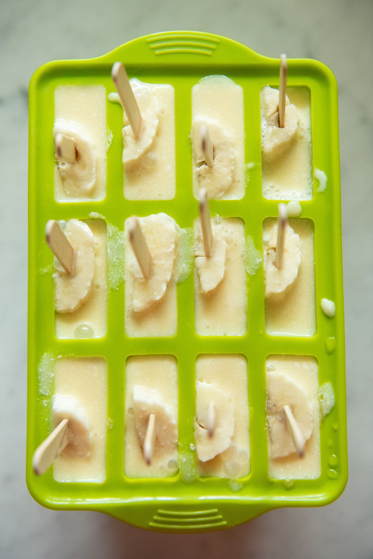 Filled popsicle molds.