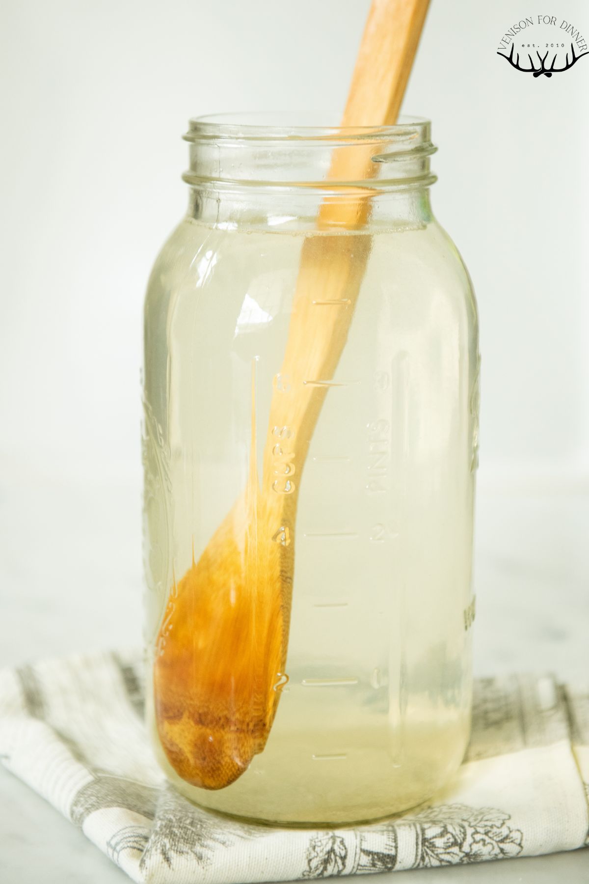 Wooden spoon in a jar of iced tea.