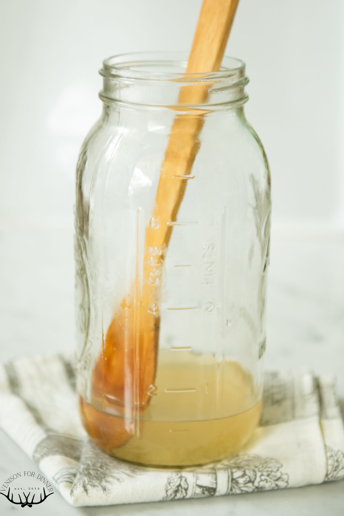 Honey being dissolved in water.