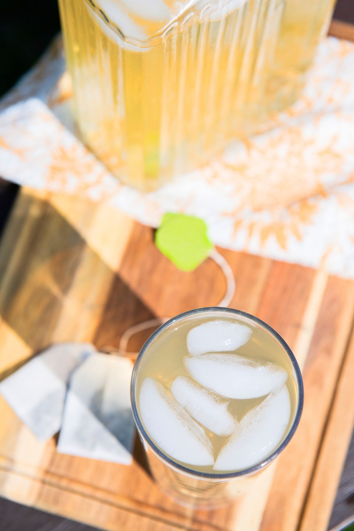 Ice in a glass of green tea.