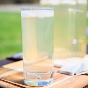Tall glass of iced tea with green tea.