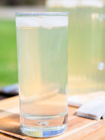 Tall glass of iced tea with green tea.