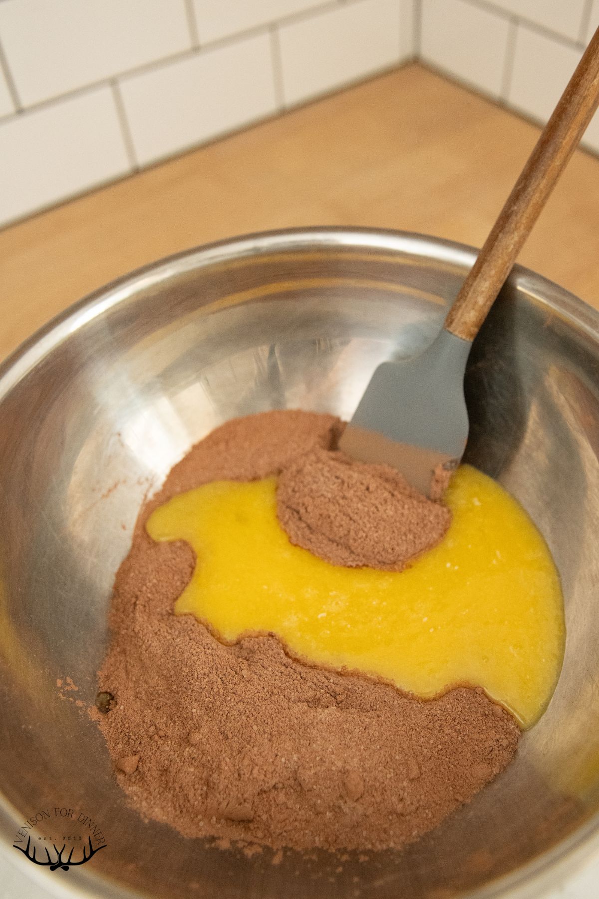 Mixing wet and dry ingredients for brownies.