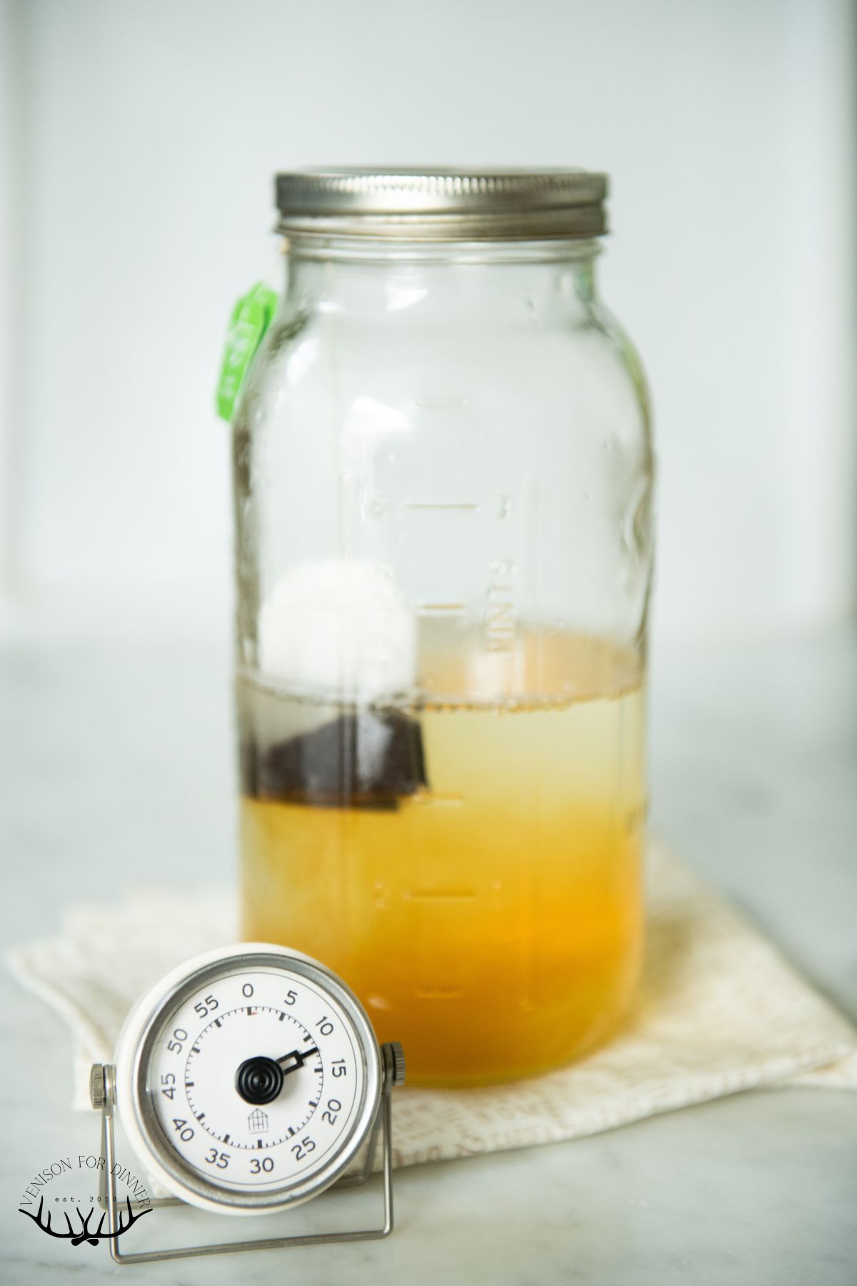 Black tea steeping in a jar.