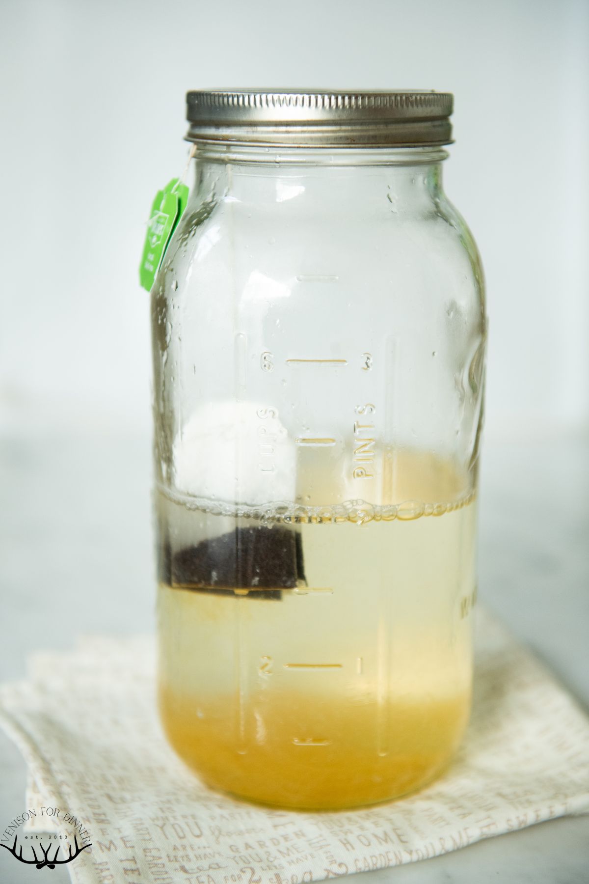 Tea bag in a jar of water.