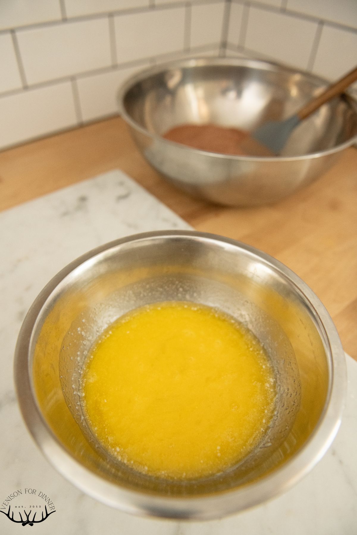 Wet ingredients for brownies in a bowl.