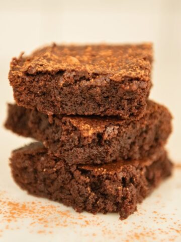Three whole wheat brownies in a stack.