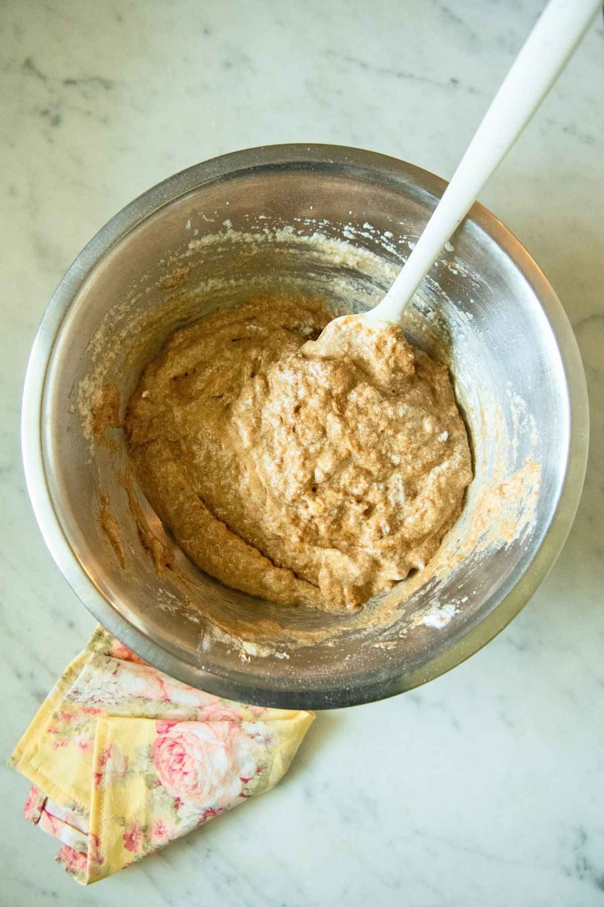Mixing banana muffin batter.