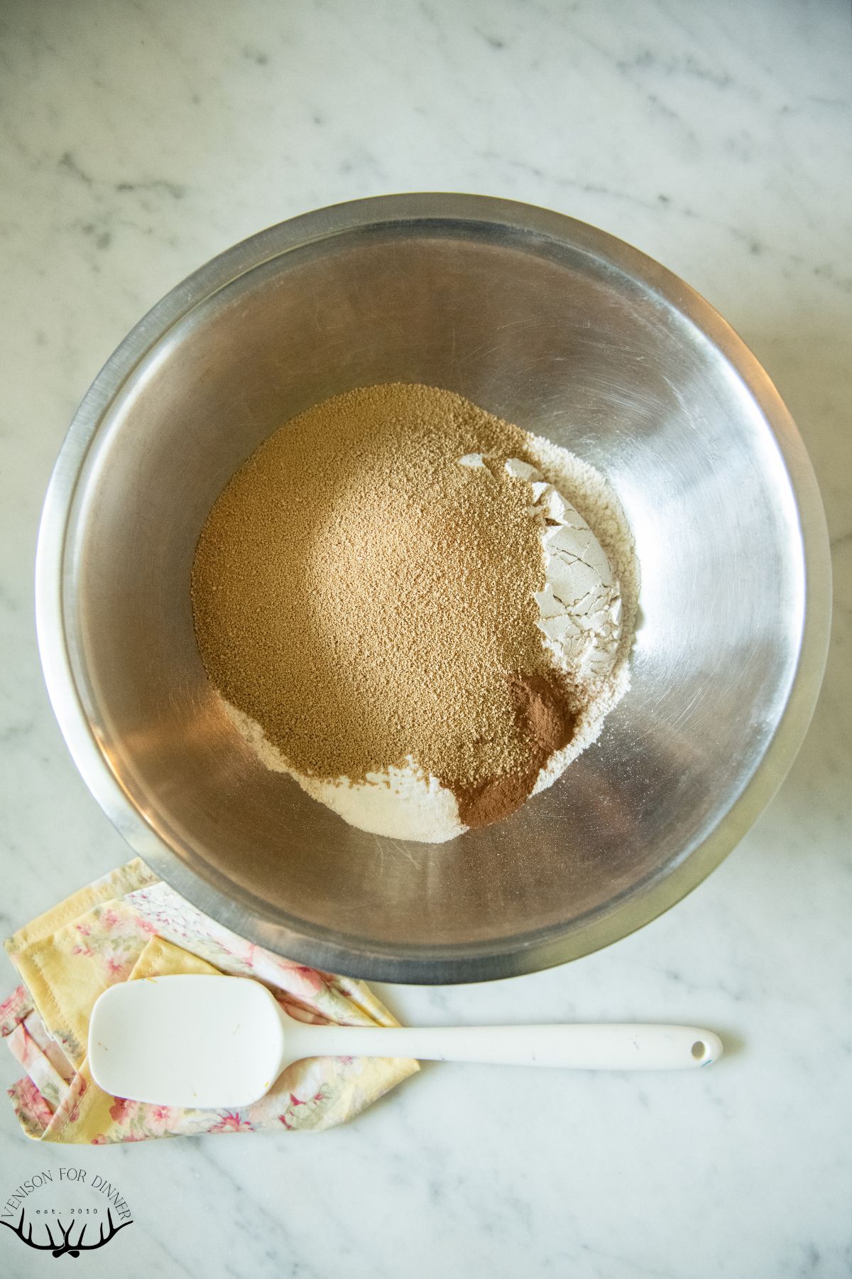 Mixing dry muffin ingredients.