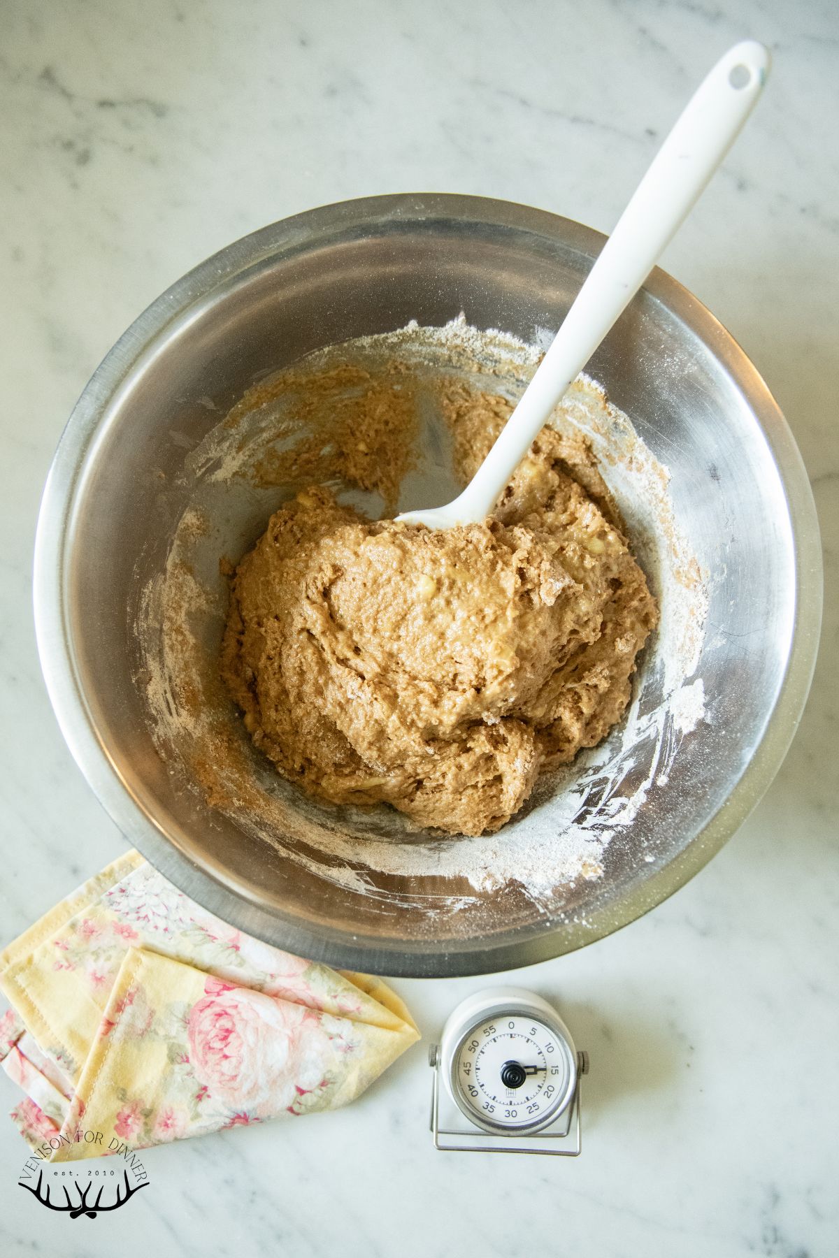 Stirring wet and dry muffin ingredients together.
