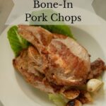 Brined bone-in pork chops on a plate.