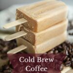 Stack of coffee ice pops on top of coffee beans.