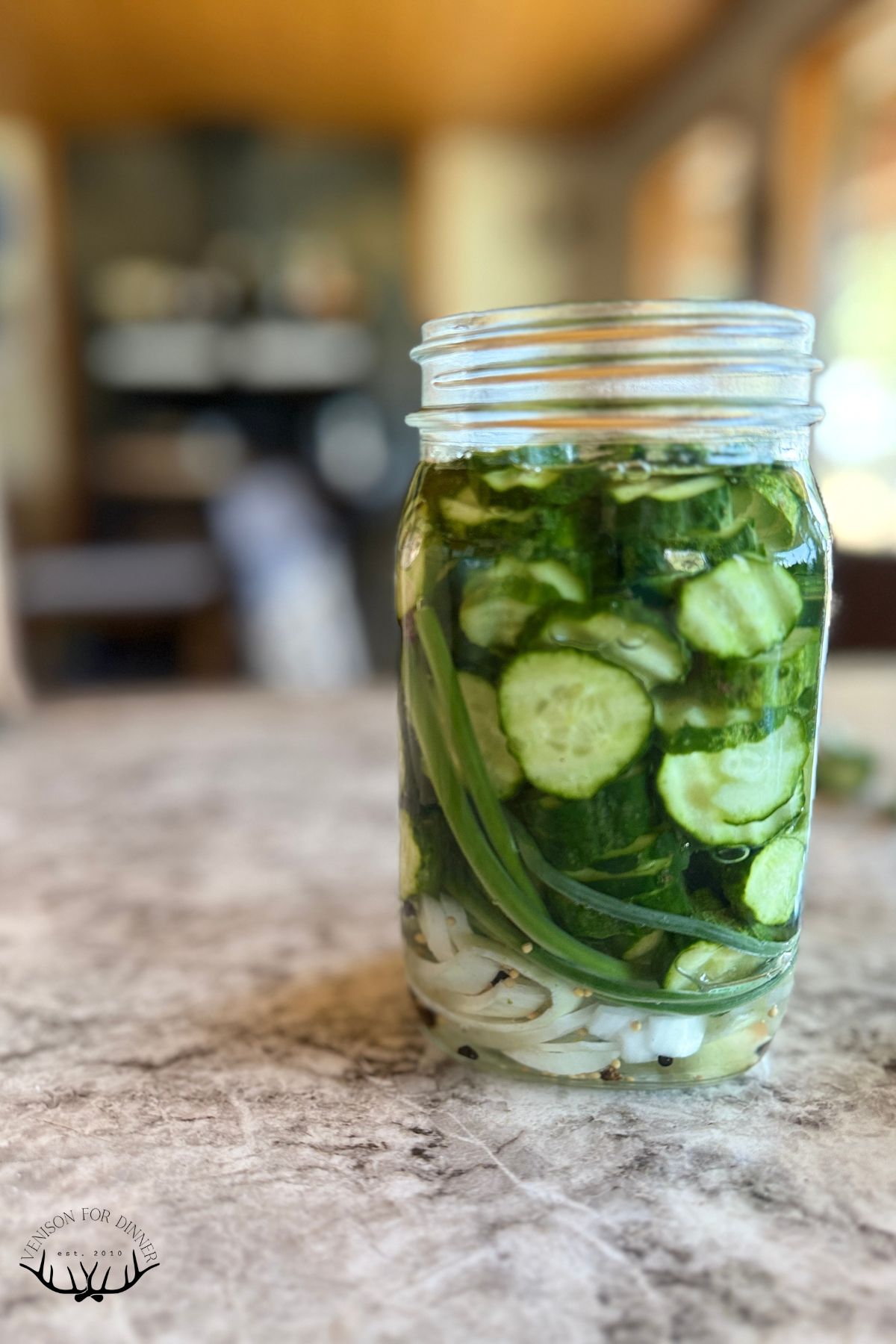 Sliced cucumbers in a mason jar.