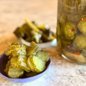 Probiotic pickle slices in a bowl.