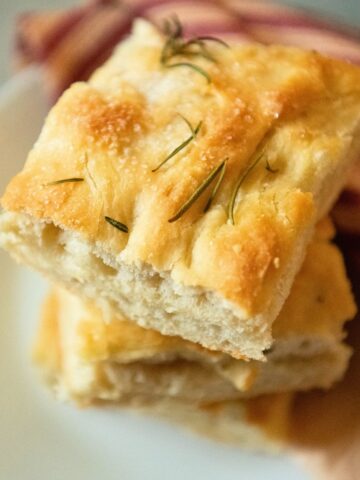 Stacked slices of focaccia.