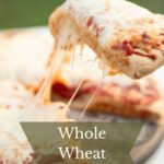 Pulling a slice of cheese pizza.