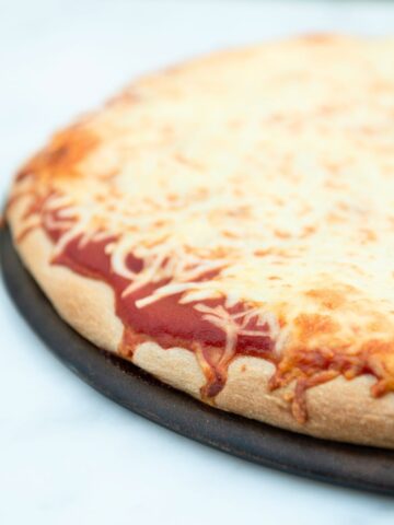 Cheese pizza with whole wheat crust.
