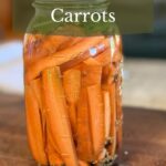 Jar of fermented carrots on the counter.
