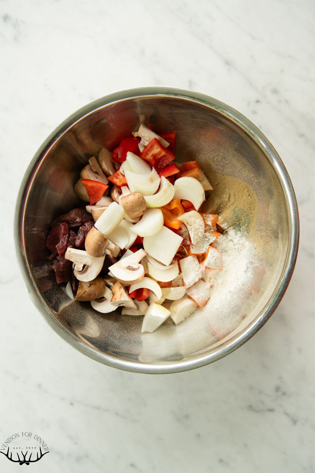 Chopped veggies in a bowl for kabobs.