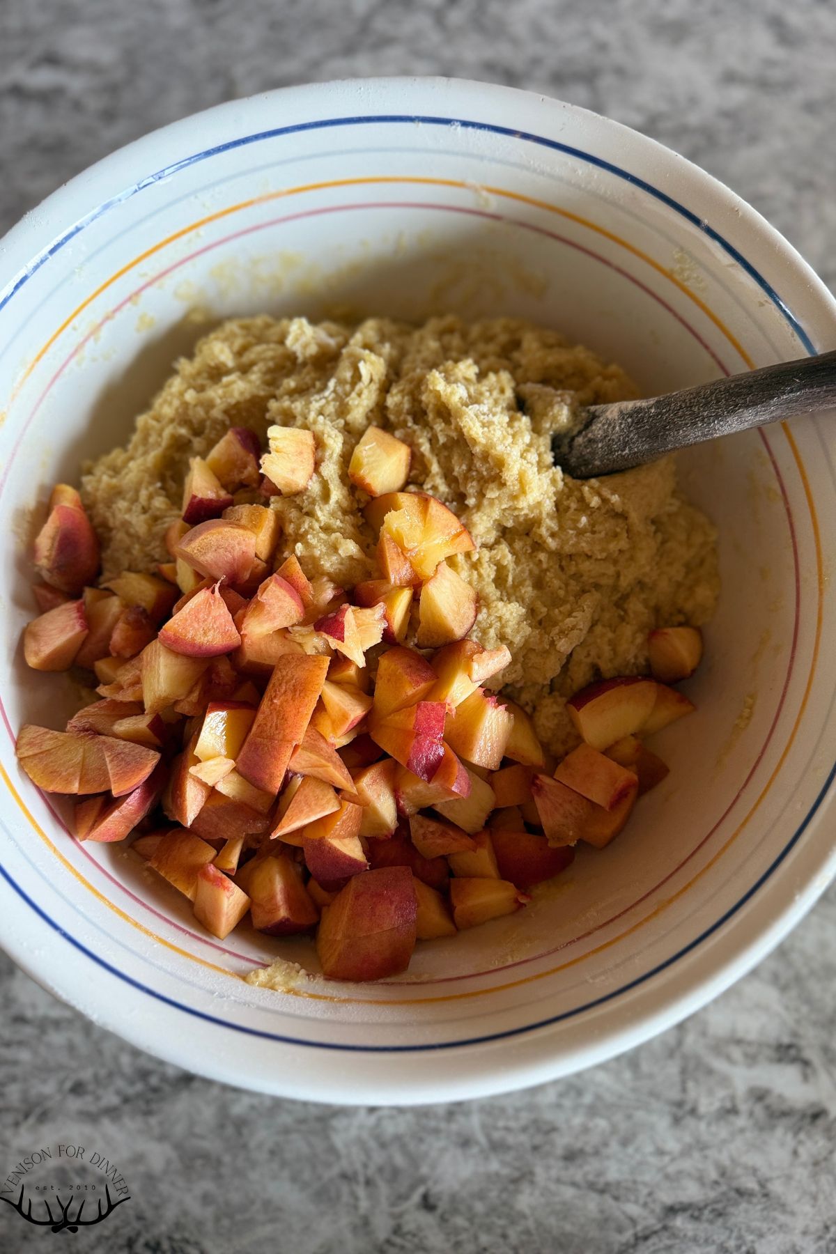 Diced peaches in batter.
