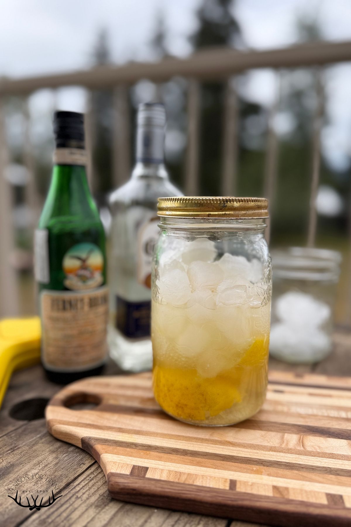 A jar of tequila honeybee ready to shake.