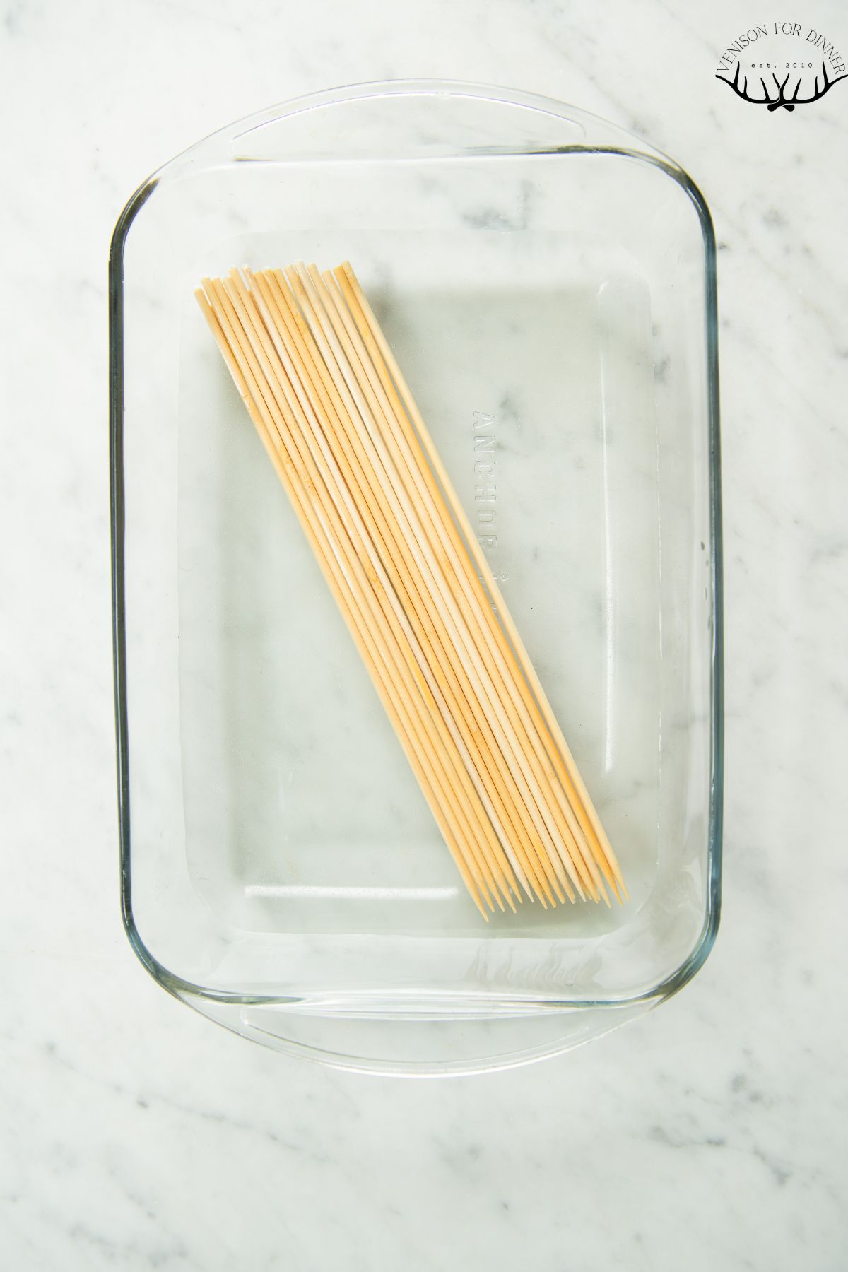 Bamboo skewers soaking in water.