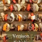 Venison kabobs on a cutting board.