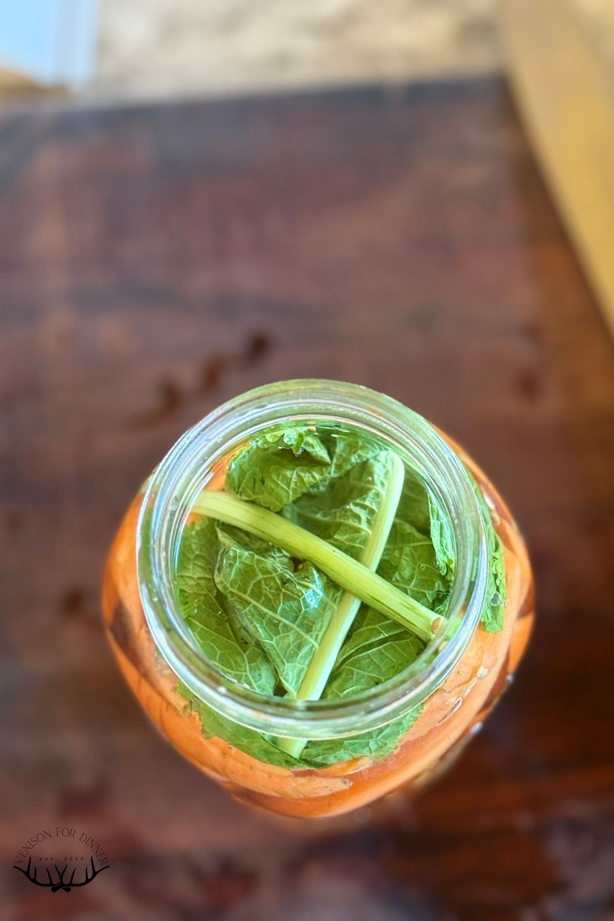 Cabbage leaf in carrot jar.