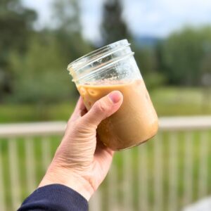 Jar of pumpkin spice latte over ice.