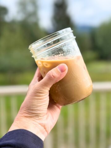 Jar of pumpkin spice latte over ice.
