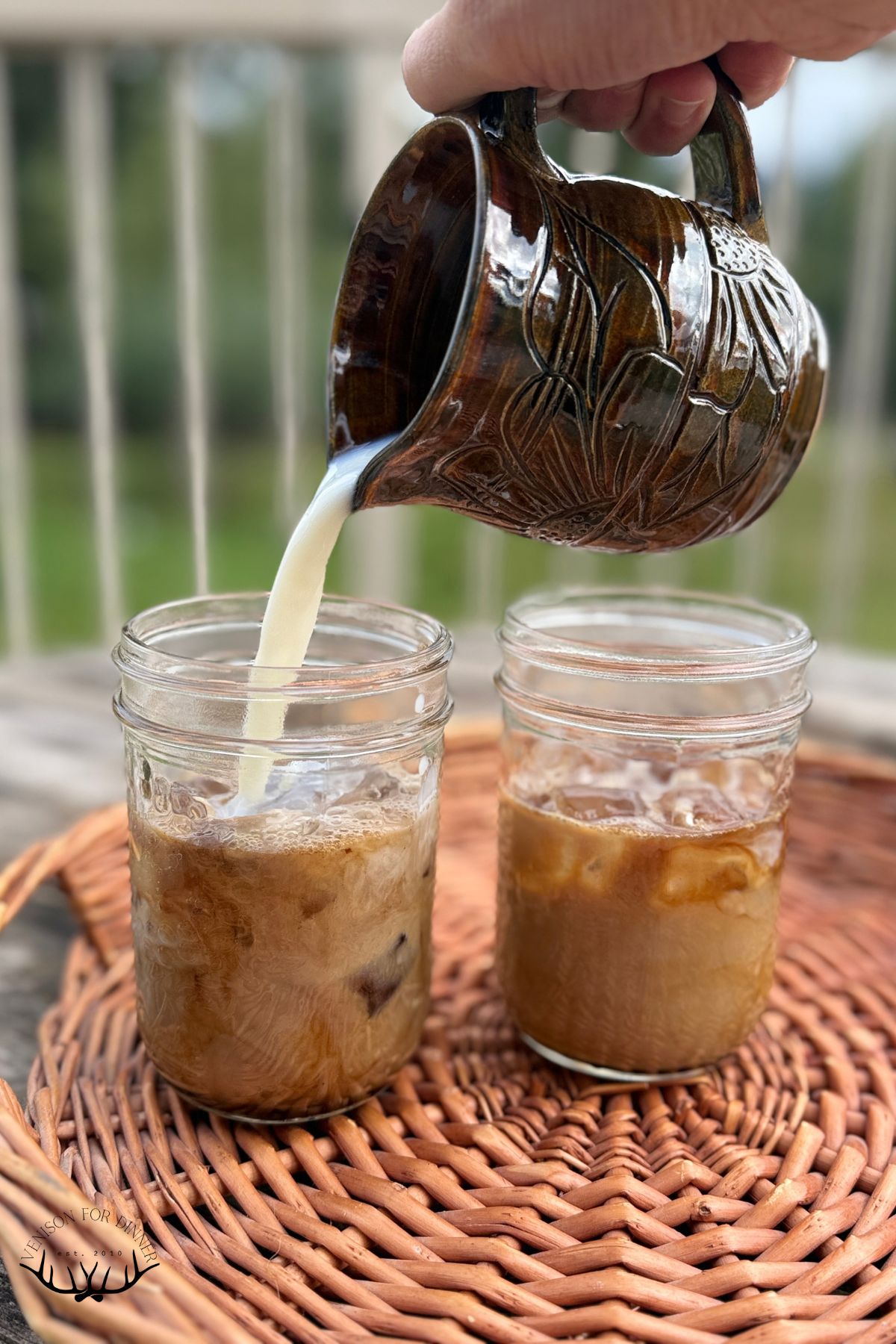 Pouring milk into a latte.
