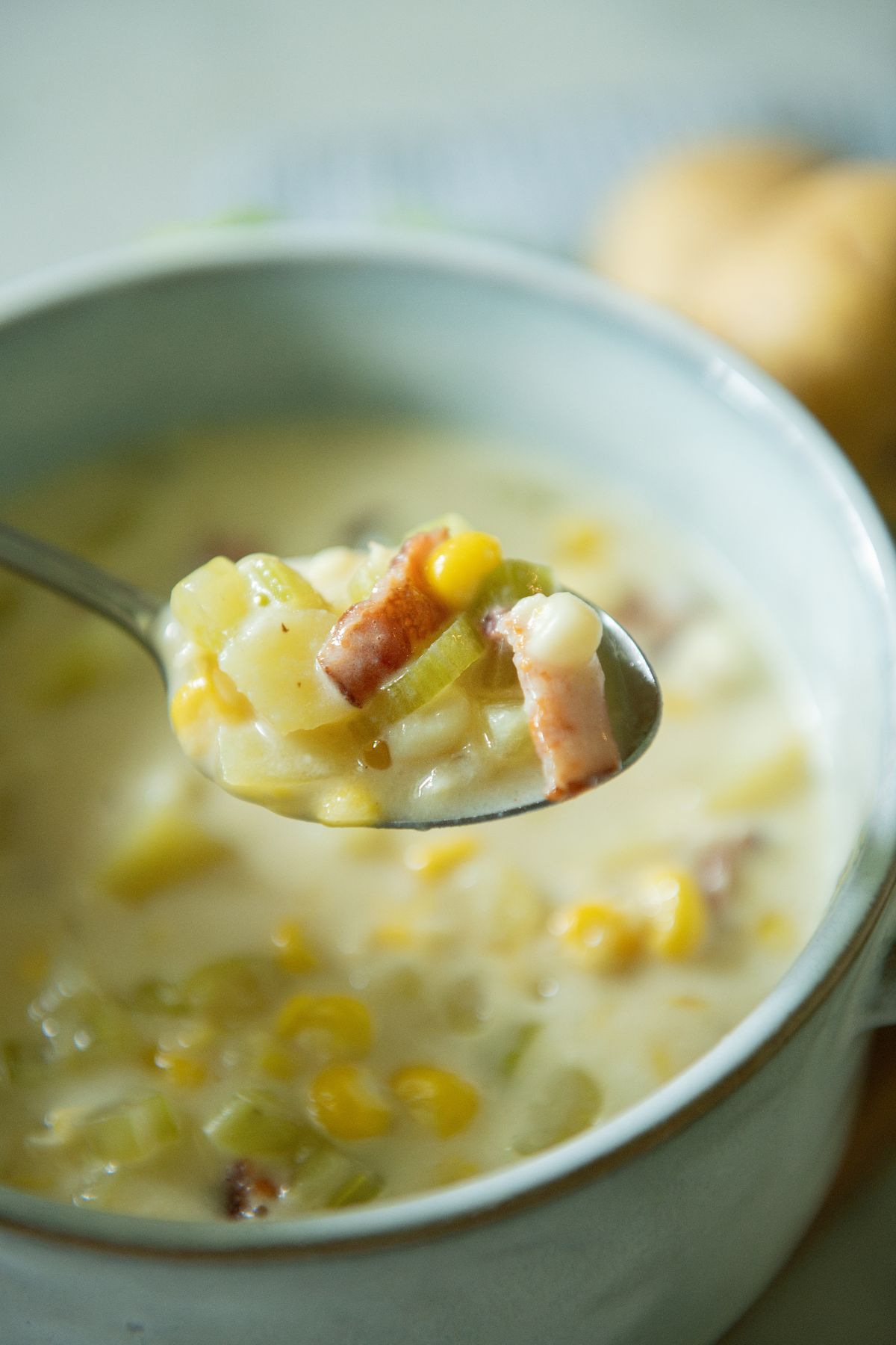 A spoonful of bacon corn chowder.