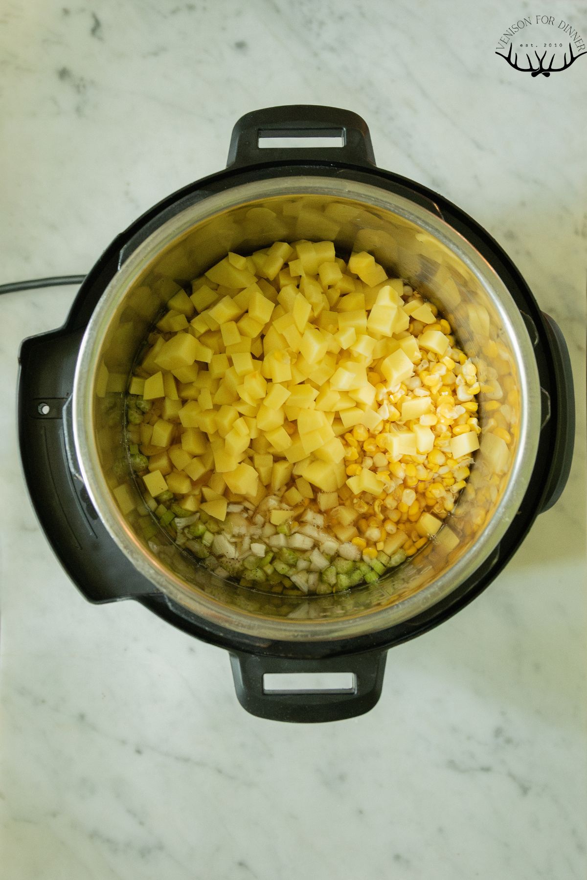 Diced potatoes and corn in an instant pot.