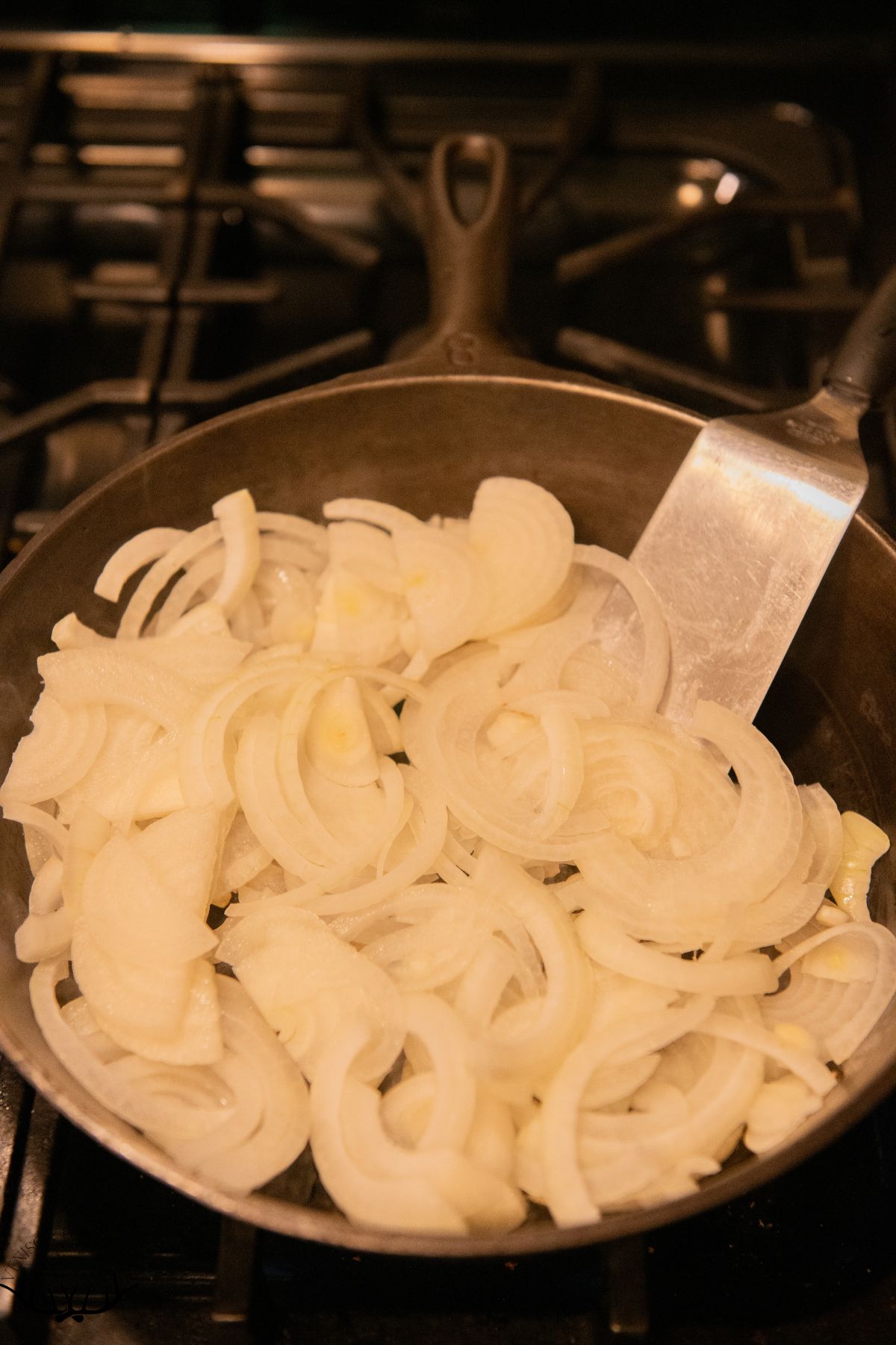 Sliced onions in a skillet.