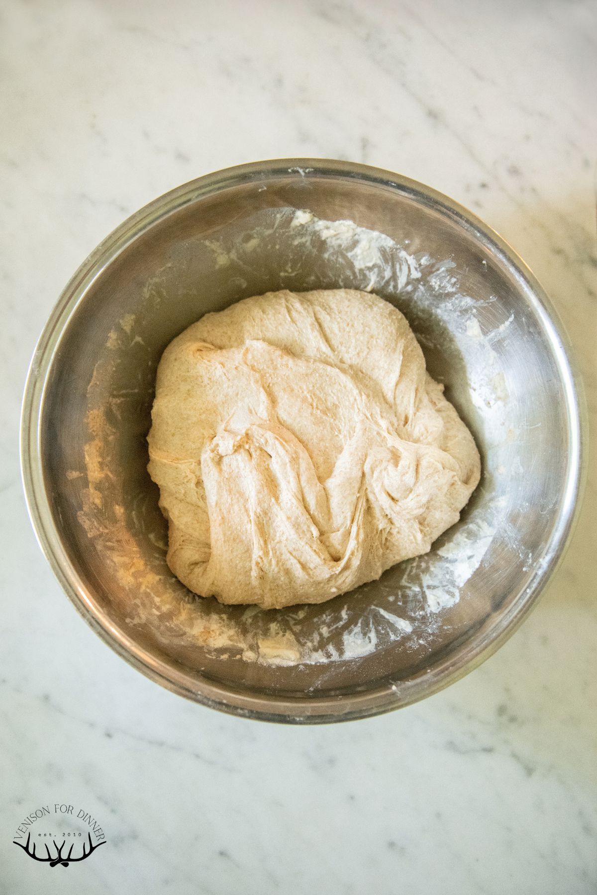 Sourdough resting in a mixing bowl.