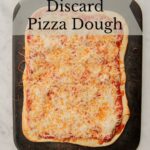 Sourdough discard pizza on a cutting board.