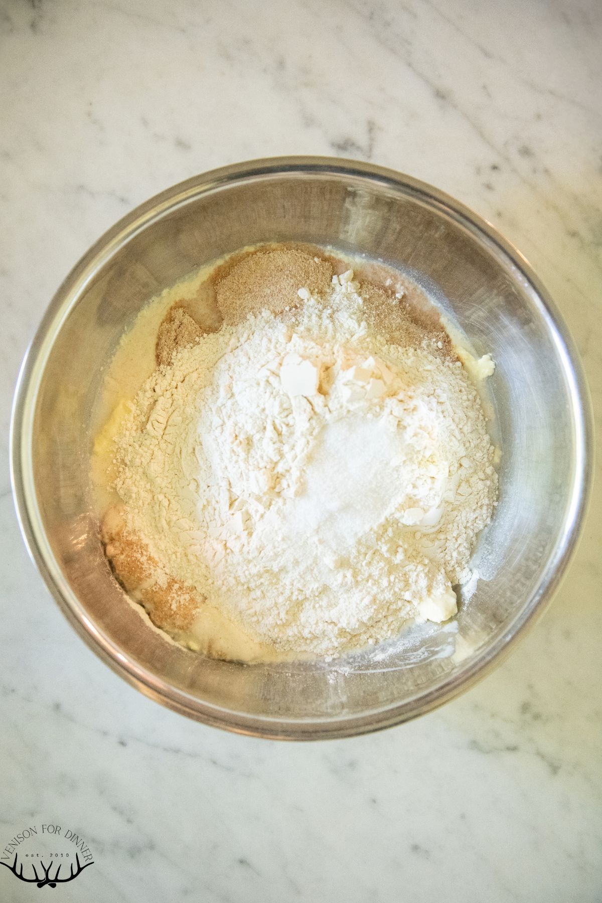 Flour in a bowl of sourdough starter.