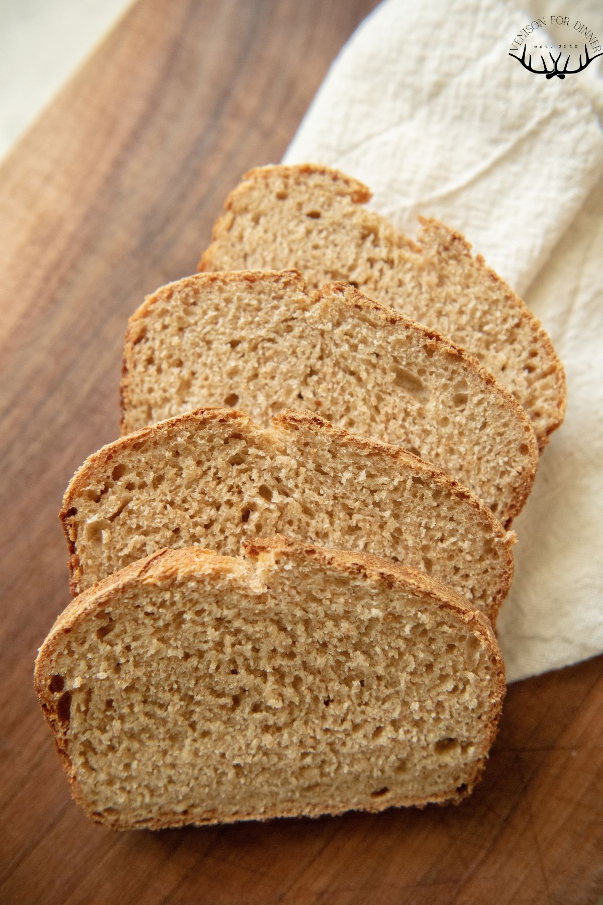 Loaf of whole grain sourdough cut in slices.