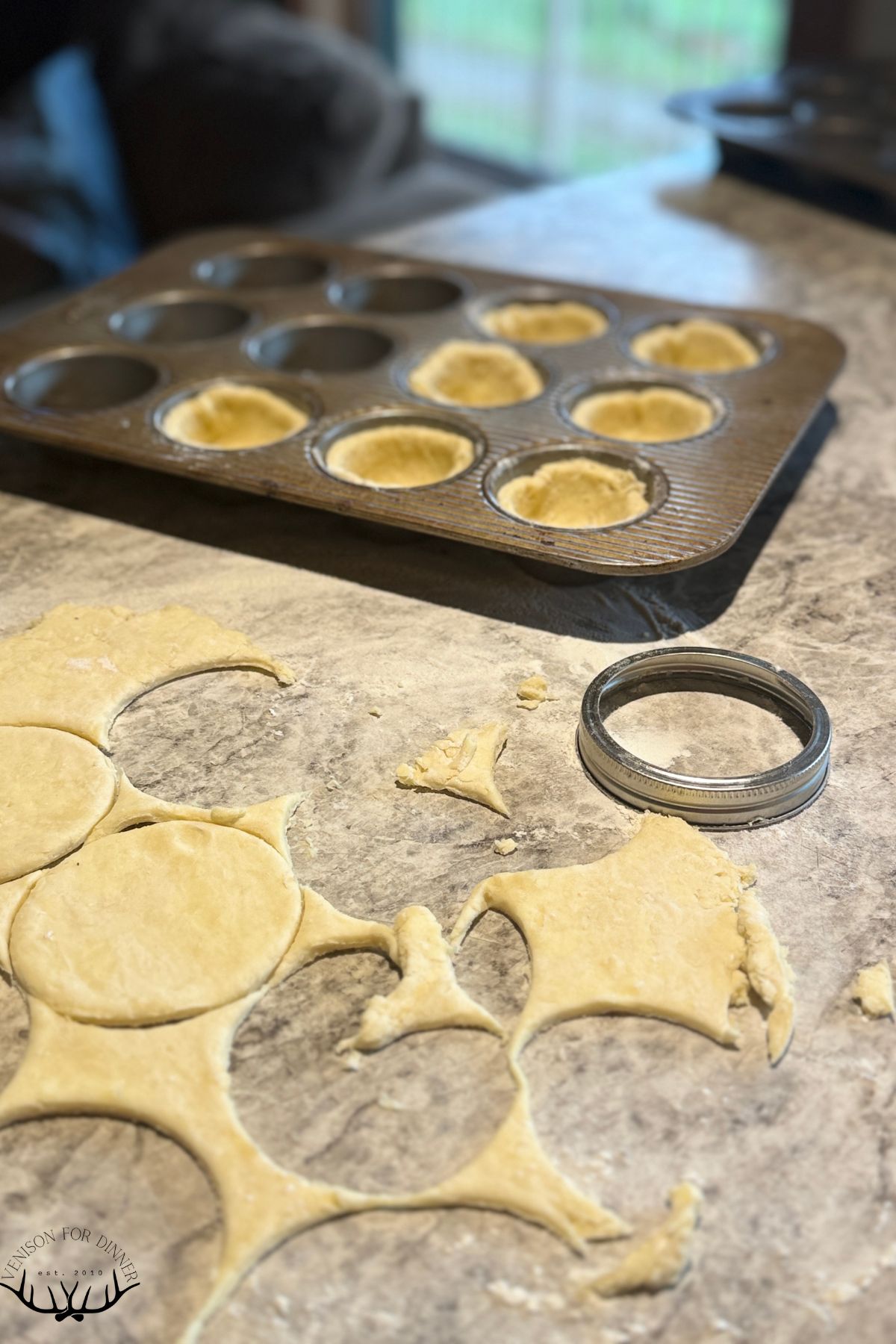 Cutting dough circles with a mason jar ring.