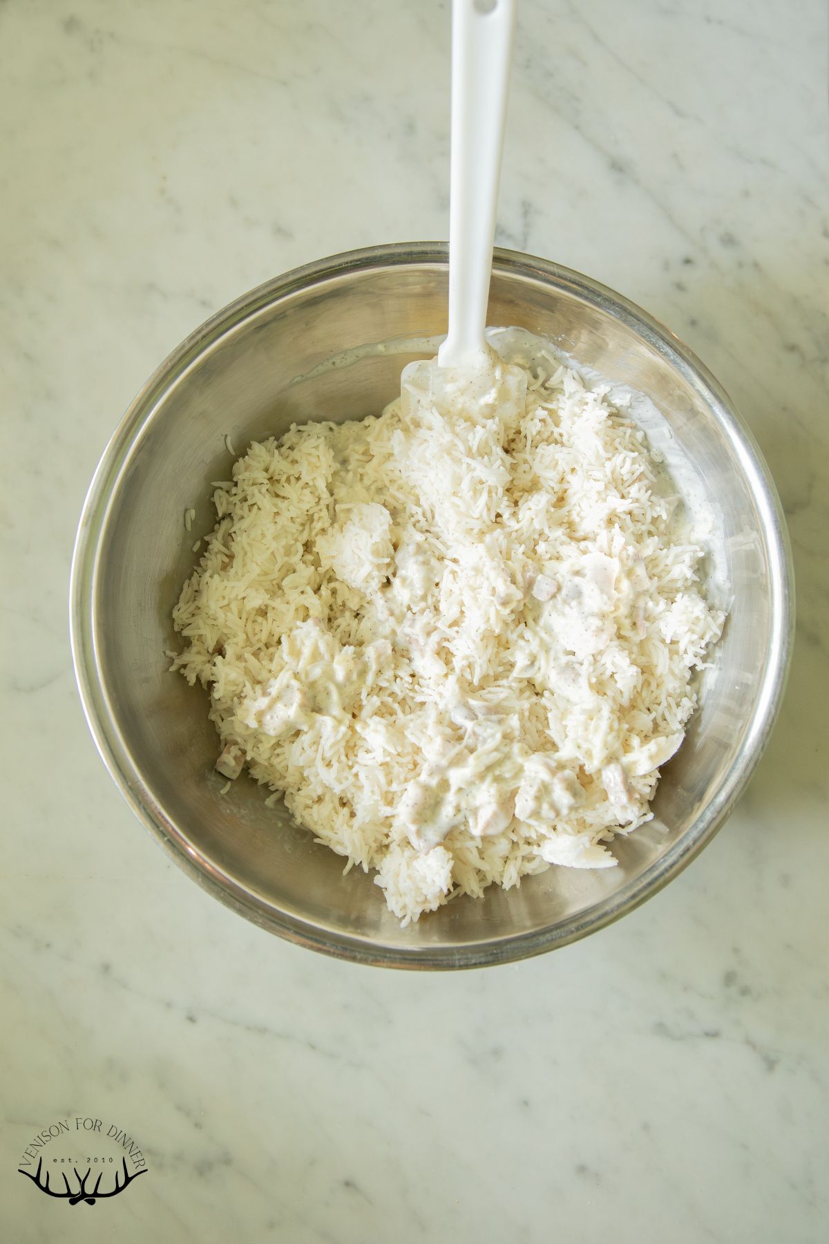Stirring rice into cream.