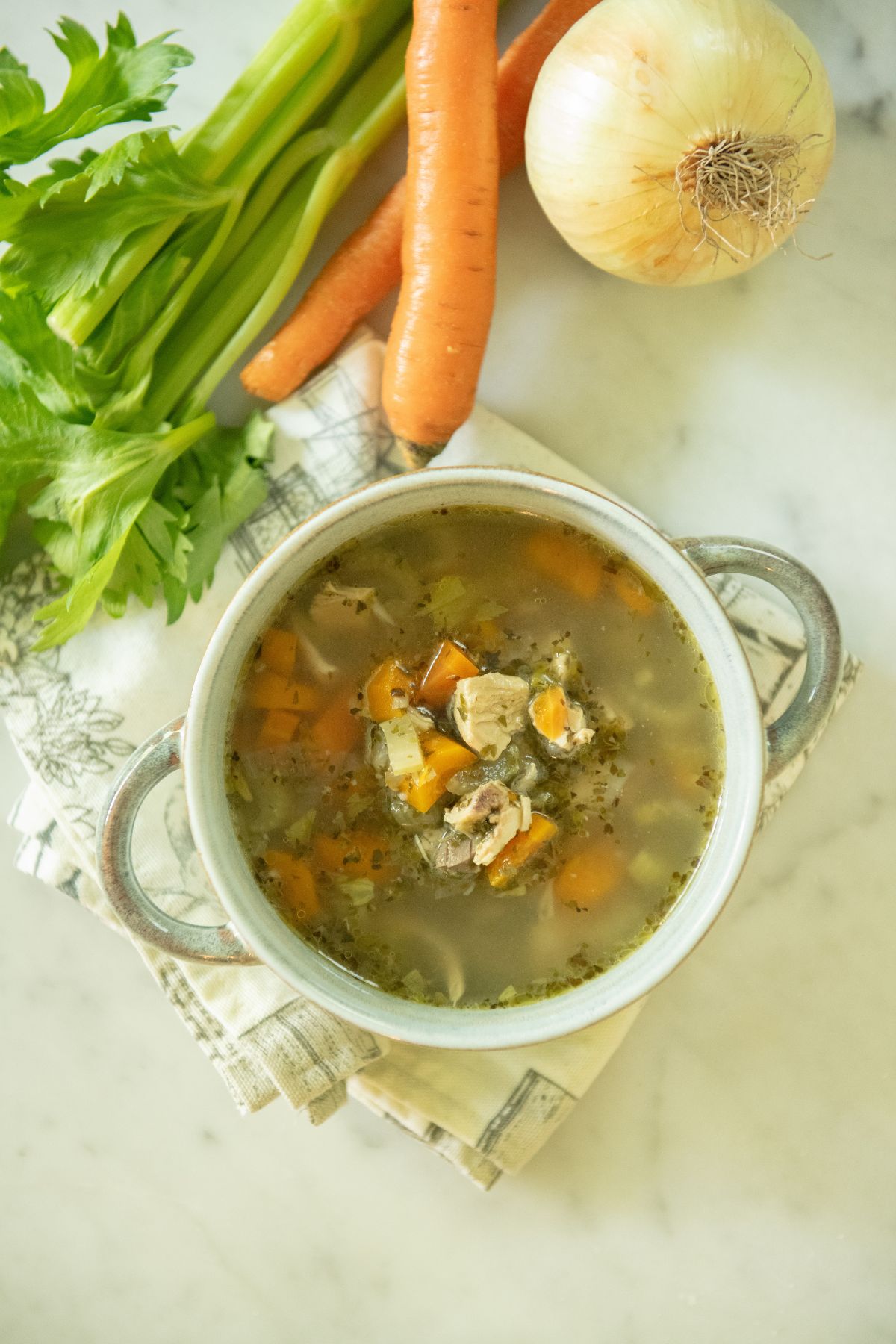 Bowl of dairy-free chicken veggie soup.