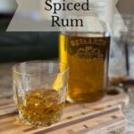 Homemade spiced rum in a rocks glass.