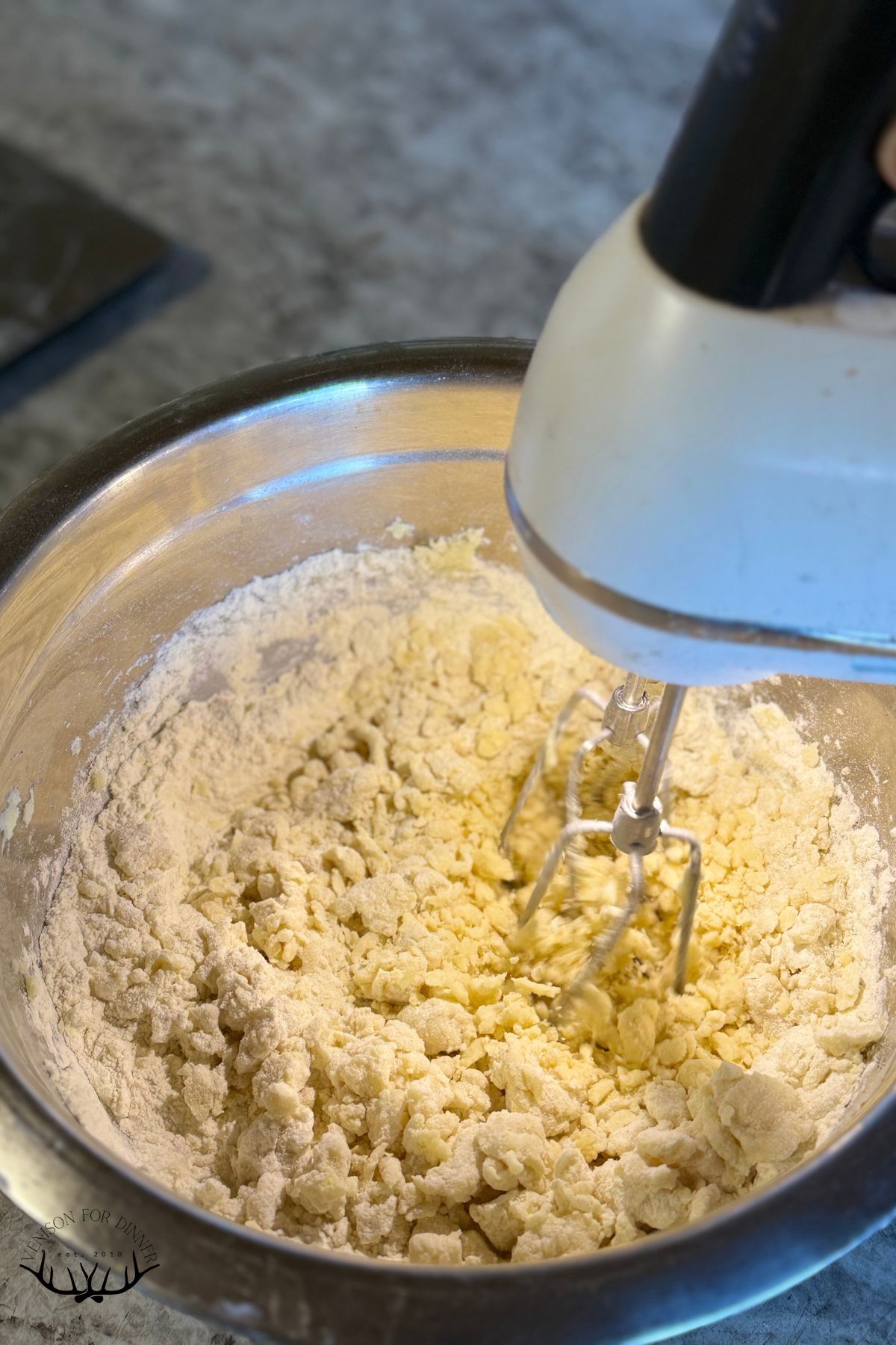 Hand mixer in butter and flour.