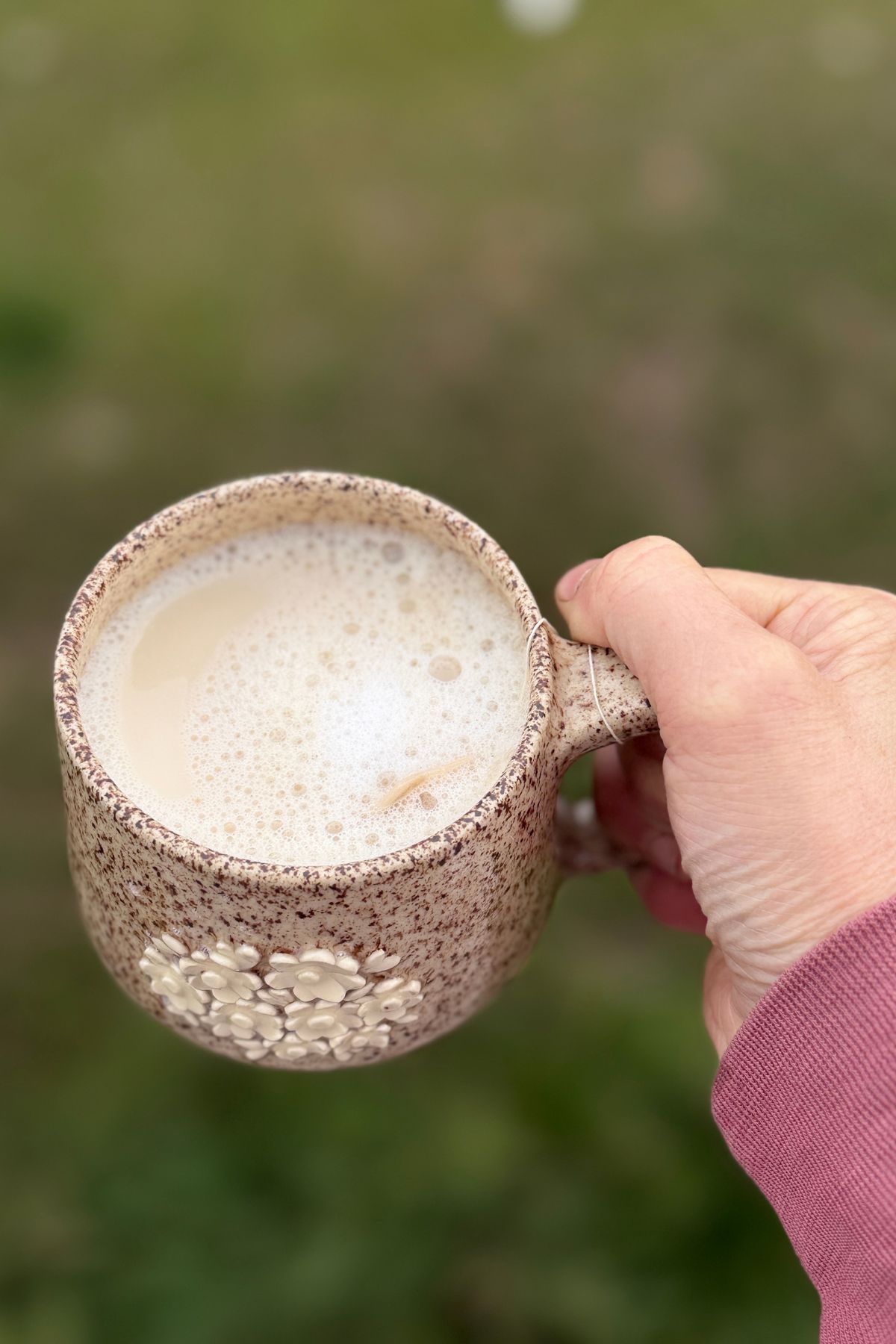 Foamy milk over a pumpkin chai latte.