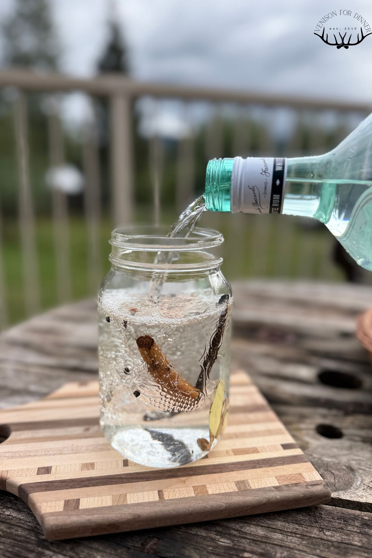 Pouring rum over whole spices.