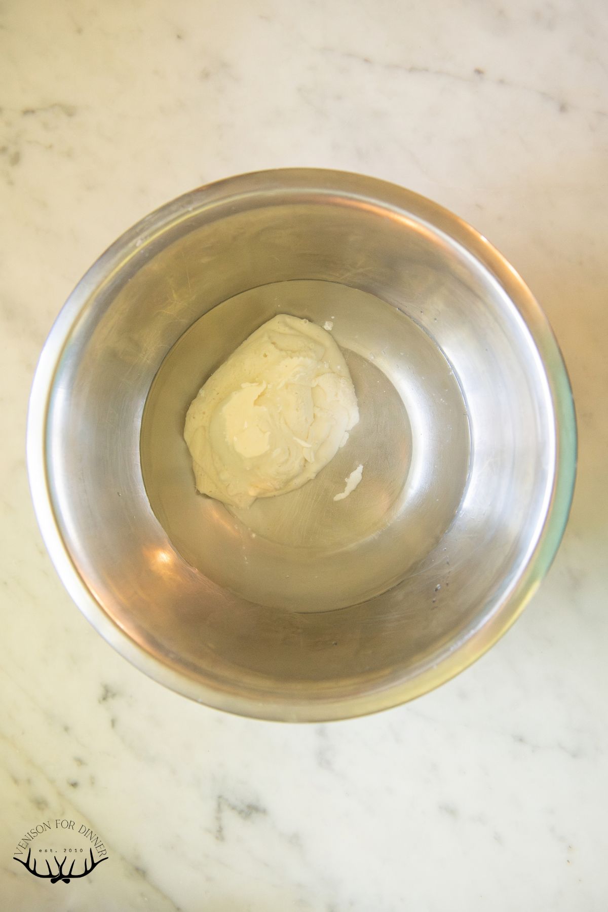 Sourdough starter in a bowl of water.