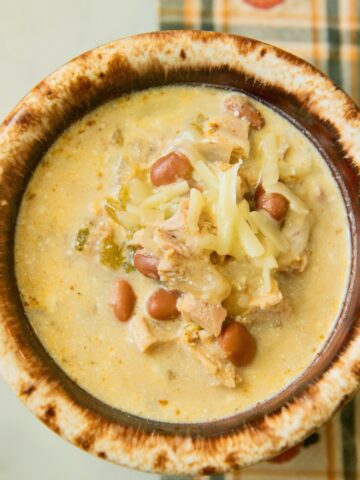 Bowl of turkey and bean chili with cheese.