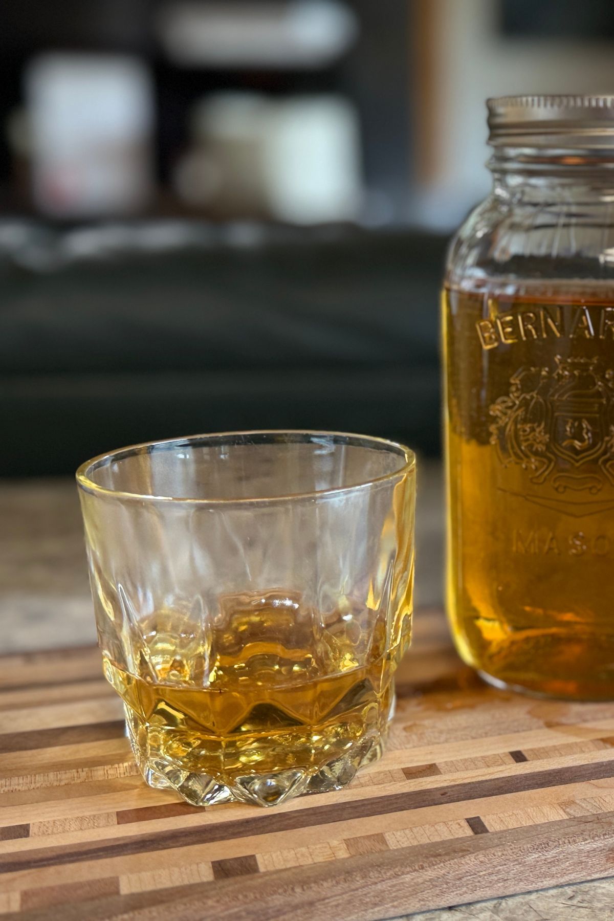 Two fingers of rum in a glass.